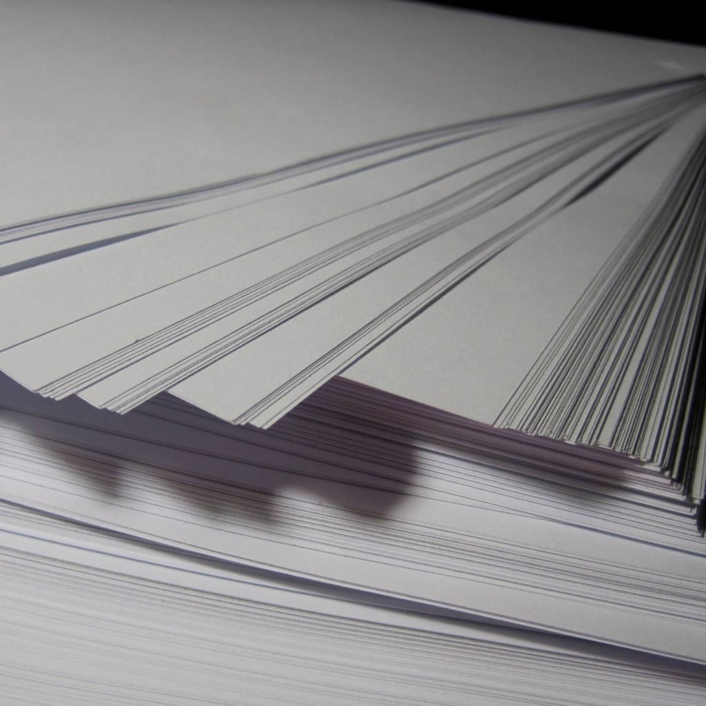 Stack of white paper close up (Business and Finance) paper,stack,tiered,white,document,blank,office,information